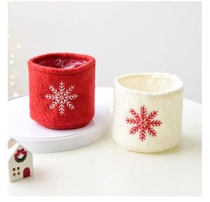 Detailed embroidery of snowflakes on premium wool felt Christmas baskets and gift liners
