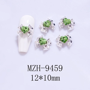 Detail of silver alloy bow nail charms with green heart zircon, size 12x10mm for DIY