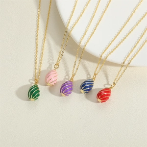 Elegant egg-shaped pendant necklaces with golden spiral patterns in five vibrant colors
