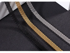 Detailed view of woven mesh bracelets in black, gold, and silver stainless steel