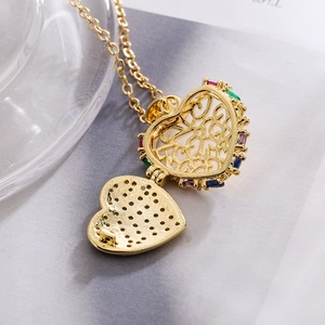 Gold plated heart locket necklace with colorful gemstones and hollow pattern