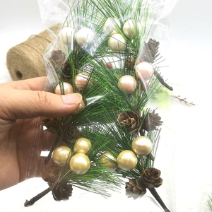 Artificial Christmas pine needles with pine cones and colorful berries for DIY holiday decor