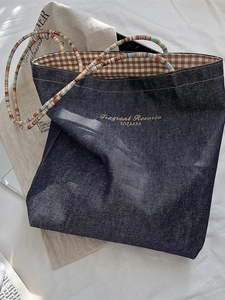 Retro denim tote bag with brown plaid lining and colorful woven handles for women