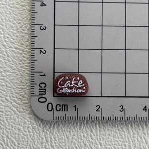 Miniature resin chocolate cake charm for DIY crafts with precise size scale measurement