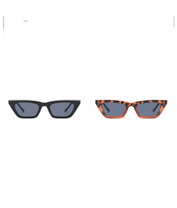Detail shot of narrow cat eye sunglasses in black and tortoiseshell finishes