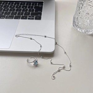 Minimalist 925 sterling silver beaded necklace with a blue gemstone open ring set