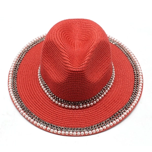 Elegant red straw sun hat with pearl and metallic diamond trim for outdoor beach travel