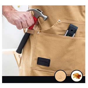 Brown heavy-duty canvas work apron with multiple pockets and waterproof fabric coating