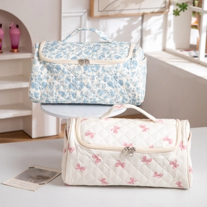 Quilted cotton travel makeup bags with floral and bow patterns and double zippers