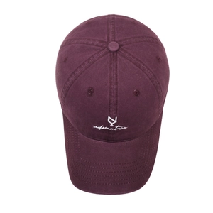 Vintage dark red baseball cap with white adventure embroidery on a white background