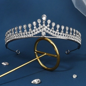 Detailed close-up of a silver bridal tiara featuring shimmering pear-shaped rhinestones