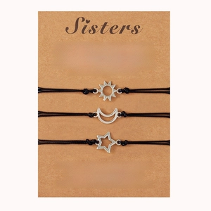 Detailed set of three sun moon and star friendship bracelets on a Sisters gift card