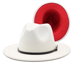 Close-up of beige fedora with red underbrim, black leather band and golden metal buckle