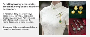 Close-up of vintage golden and emerald dragonfly pendant used as a cheongsam accessory
