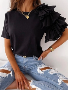Detail of layered ruffle sleeve on black crew neck t-shirt with soft cotton texture
