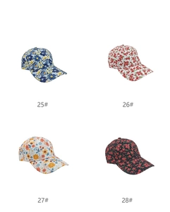 Collage of four digital floral print baseball caps in various colors with style numbers