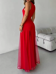 Detail of red sleeveless maxi dress showing the sheer mesh layered hem and slim silhouette
