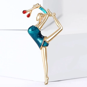 Elegant gold metal dancing girl brooch with blue enamel and red stone accents