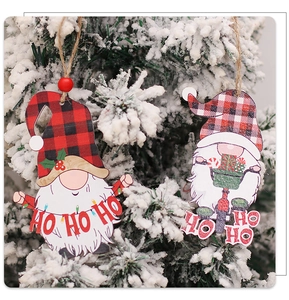 Detail of wooden Christmas gnome ornaments with red buffalo plaid and HO HO HO text