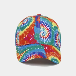 Detail view of the colorful tie-dye canvas fabric and stitching on this sun baseball cap