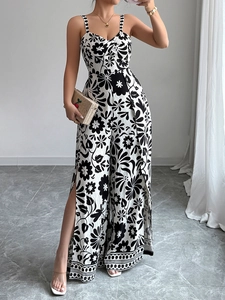 Detail of elegant black and white print jumpsuit with V-neck and high side leg slits