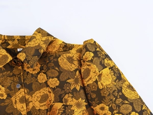Detailed view of brown and gold floral brocade fabric with elegant collar and buttons