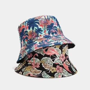 Tropical flamingo and palm leaf print bucket hats in light blue and black canvas fabric