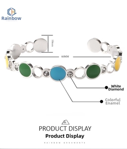 Detail view of C-shaped colorful enamel bangle with white rhinestones and 60mm diameter