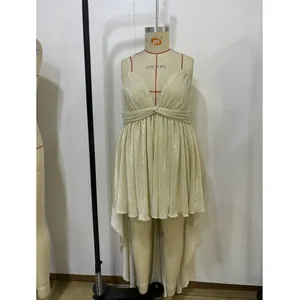 Detail of V-neck champagne pleated high-low dress with metallic texture on mannequin