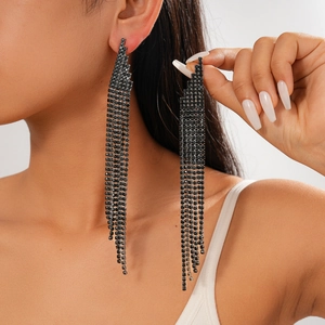 Dramatic long tassel drop earrings with black rhinestones shown on model for elegant look