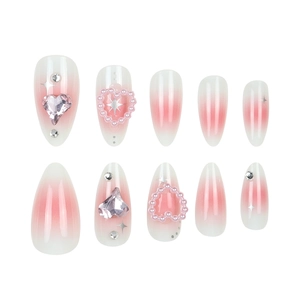 Unghie a mandorla press-on con sfumatura rosa, cuori di perle e stelle di strass luce