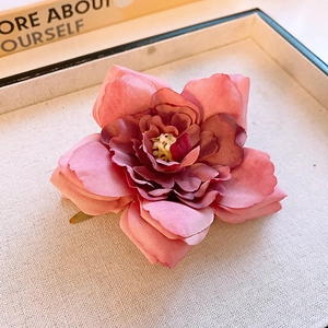 Pink fabric orchid flower hair claw clip with gradient petals and yellow center