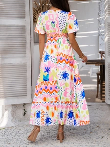 Back view of a vibrant bohemian maxi dress with abstract print and high waist detail