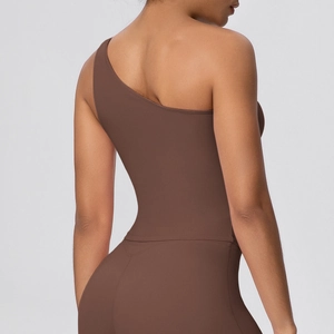 Detail of coffee brown one-shoulder sports bra with seamless back design and elastic fabric
