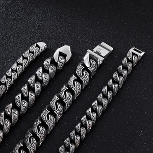 Men's wide stainless steel Cuban link bracelet with engraved vintage floral patterns