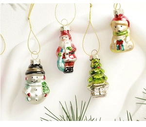 Set of four glossy Christmas glass ornaments featuring Santa, Snowman, and Tree motifs