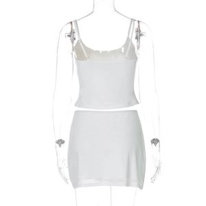 Close-up back view of white two-piece set with rhinestone straps on a mannequin