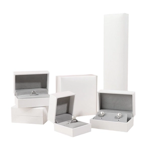 White textured jewelry box set with grey velvet lining for rings and necklaces
