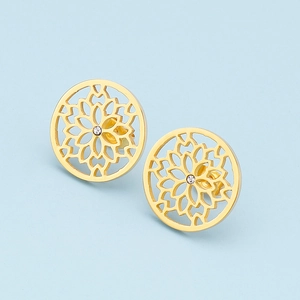 Elegant gold round hollow floral earrings with crystal center on a light blue background