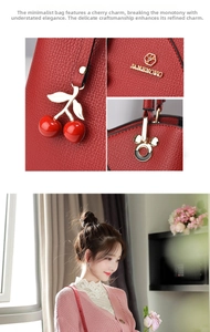 Detail of red lychee grain leather handbag with cherry charm and Mickey shaped buckles