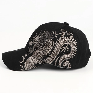 Black baseball cap featuring intricate silver dragon embroidery and classic curved brim