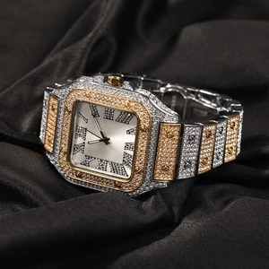 Detailed view of square iced-out quartz watch with Roman numerals on silk background
