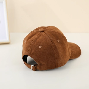 Brown corduroy baseball cap with adjustable metal buckle and classic curved brim for kids