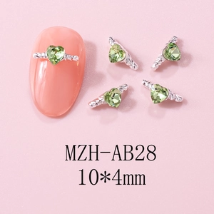 Detailed view of 10x4mm light green heart nail rhinestones with silver metal base