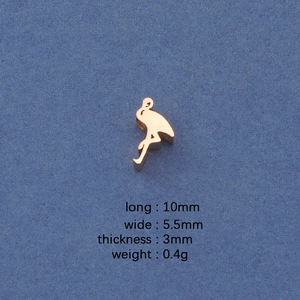 Macro view of golden flamingo charm with detailed dimensions 10x5.5mm and 0.4g weight