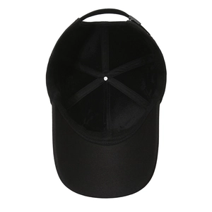 Inside view of black cotton baseball cap showing six-panel stitching and adjustable strap
