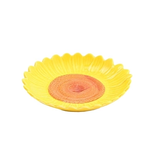 Sunflower shaped ceramic snack plate with yellow petals and orange center on white background