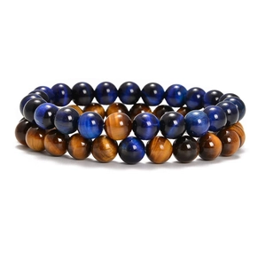 Close-up of blue and gold tiger eye natural stone beaded bracelets set of two