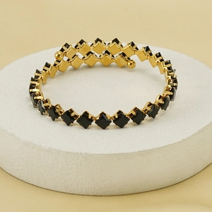 18k gold plated stainless steel cuff bracelet with square black zircon on stone display