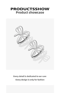 Detail of silver bow-knot hoop earrings in polished 925 sterling silver minimalist style